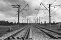 Writhing and leaving in the distance railway tracks and electric poles along them. Royalty Free Stock Photo