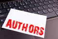 Writing Authors text made in the office close-up on laptop computer keyboard. Business concept for Word Message Text Typography Wo