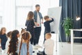 Writing on the board. Group of children students in class at school with teacher Royalty Free Stock Photo