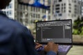 Writing code, laptop closeup and software developer on park bench Royalty Free Stock Photo