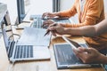Writing codes and typing data code technology, Programmer cooperating working on web site project in a software developing on Royalty Free Stock Photo