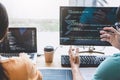 Writing codes and typing data code technology, Programmer cooperating working on web site project in a software developing on Royalty Free Stock Photo