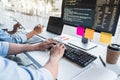 Writing codes and typing data code technology, Programmer cooperating working on web site project in a software developing on Royalty Free Stock Photo