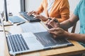 Writing codes and typing data code technology, Programmer cooperating working on web site project in a software developing on Royalty Free Stock Photo