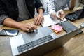 Writing codes and typing data code technology, Programmer team working on web site project in a software development on desktop Royalty Free Stock Photo