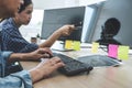 Writing codes and typing data code technology, Two professional programmer cooperating working on web site project in a software Royalty Free Stock Photo