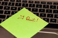 Writing on colorful sticky note I quit. Text with I quit on paper. Sticky note, post it on keyboard Royalty Free Stock Photo