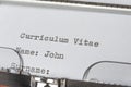 Writing a curriculum vitae with typewriter