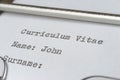 Writing a curriculum vitae with typewriter