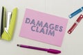 Text caption presenting Damages Claim. Word Written on Demand Compensation Litigate Insurance File Suit Royalty Free Stock Photo