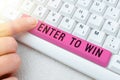 Handwriting text Enter To Win. Concept meaning Sweepstakes Trying the luck to earn the big prize Lottery Hand Holding