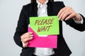 Writing displaying text Please Wait. Internet Concept to pause any implemented action immediately and hold on Royalty Free Stock Photo