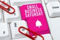 Writing displaying text Small Business Saturday. Concept meaning American shopping holiday held during the Saturday Royalty Free Stock Photo