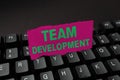 Writing displaying text Team Development. Word Written on learn why and how small groups change over time with graphs Royalty Free Stock Photo
