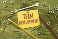 Text caption presenting Team Development. Concept meaning learn why and how small groups change over time with graphs Royalty Free Stock Photo