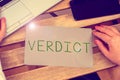 Writing displaying text Verdict. Business overview decision on disputed issue in a civil or criminal case or inquest