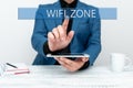 Writing displaying text Wifi Zone. Concept meaning provide wireless highspeed Internet and network connections