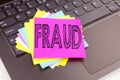 Writing Fraud text made in the office close-up on laptop computer keyboard. Business concept for Criminal hacker security preventi