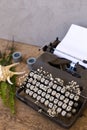 Writing and freelance concept. Vintage typewriter with flowers b Royalty Free Stock Photo