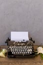 Writing and freelance concept. Vintage typewriter with flowers Royalty Free Stock Photo