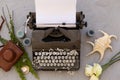 Writing and freelance concept. Vintage typewriter, seashells and Royalty Free Stock Photo