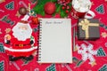 Writing a letter to Santa Claus on a festive red background with Christmas gifts, a plate in the shape of Santa Claus Royalty Free Stock Photo