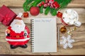 Writing a letter to Santa Claus on a wooden background with Christmas gifts and decorations, a plate in the shape of Santa Claus. Royalty Free Stock Photo