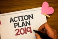 Writing note showing Action Plan 2019. Business photo showcasing Challenge Ideas Goals for New Year Motivation to Start Man holdi Royalty Free Stock Photo