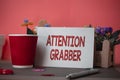 Writing note showing Attention Grabber. Business photo showcasing Deanalysisding notice mainly by being prominent or