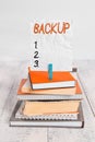 Writing note showing Backup. Business photo showcasing copy of file or other item data made in case original is lost damaged pile