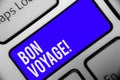 Writing note showing Bon Voyage. Business photo showcasing used express good wishes to someone about set off on journey Keyboard b Royalty Free Stock Photo