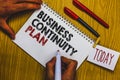 Writing note showing Business Continuity Plan. Business photo showcasing creating systems prevention deal potential threats Man ho Royalty Free Stock Photo