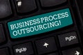 Writing note showing Business Process Outsourcing. Business photo showcasing Contracting work to external service