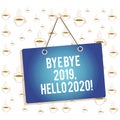 Writing note showing Bye Bye 2019 Hello 2020. Business photo showcasing saying goodbye to last year and welcoming Royalty Free Stock Photo