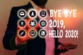 Writing note showing Bye Bye 2019 Hello 2020. Business photo showcasing saying goodbye to last year and welcoming Royalty Free Stock Photo