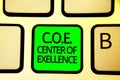 Writing note showing C.O.E Center Of Excellence. Business photo showcasing being alpha leader in your position Achieve Keyboard gr