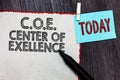 Writing note showing C.O.E Center Of Excellence. Business photo showcasing being alpha leader in your position Achieve White page