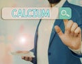 Writing note showing Calcium. Business photo showcasing fifth most abundant element in the human body Silverwhite metal Royalty Free Stock Photo