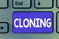 Writing note showing Cloning. Business photo showcasing Make identical copies of someone or something Creating clones