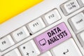 Writing note showing Data Analysts. Business photo showcasing Programmer Design and Create Report Identifies patterns Royalty Free Stock Photo