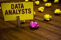 Writing note showing Data Analysts. Business photo showcasing Programmer Design and Create Report Identifies patterns Royalty Free Stock Photo