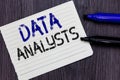 Writing note showing Data Analysts. Business photo showcasing Programmer Design and Create Report Identifies patterns Notebook Pap Royalty Free Stock Photo