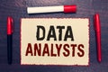 Writing note showing Data Analysts. Business photo showcasing Programmer Design and Create Report Identifies patterns Open noteboo Royalty Free Stock Photo