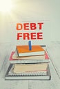 Writing note showing Debt Free. Business photo showcasing free from owning any money to any individual or a company pile Royalty Free Stock Photo