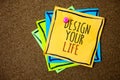 Writing note showing Design Your Life. Business photo showcasing Set plans Life goals Dreams take control To do list Papers beaut