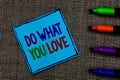 Writing note showing Do What You Love. Business photo showcasing Make enjoyable things do activities with motivation Blue paper on