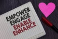 Writing note showing Empower Engage Enable Enhance. Business photo showcasing Empowerment Leadership Motivation Engagement Striket