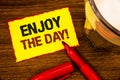 Writing note showing Enjoy The Day Motivational Call. Business photo showcasing Enjoyment Happy Lifestyle Relaxing Time Words yel