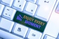 Writing note showing Enjoy Every Moment. Business photo showcasing being pleased with your life Have fun Precious time Royalty Free Stock Photo