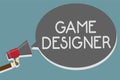 Writing note showing Game Designer. Business photo showcasing Campaigner Pixel Scripting Programmers Consoles 3D Graphics Man hold